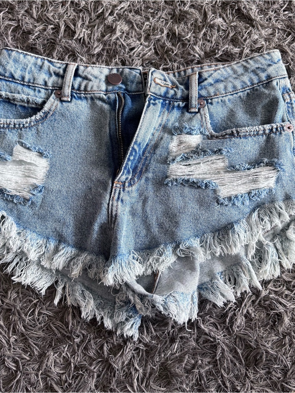 YouCom 
Distressed Light Blue Denim Cutoff Shorts with Frayed Hem